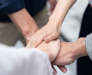 Zusammenhalt mit Händen