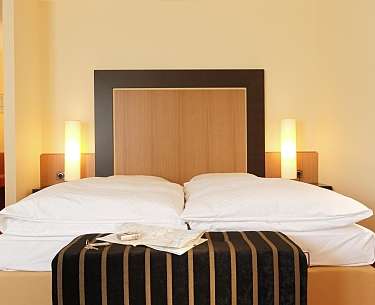 bed in a comfort class room  bed in a comfort class room