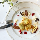 Goat&#039;s cheese praline baked in a vine leaf 